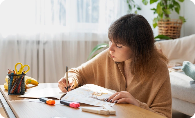 Child writing at desk — developing writing skills for NAPLAN Years 3,5,7,9