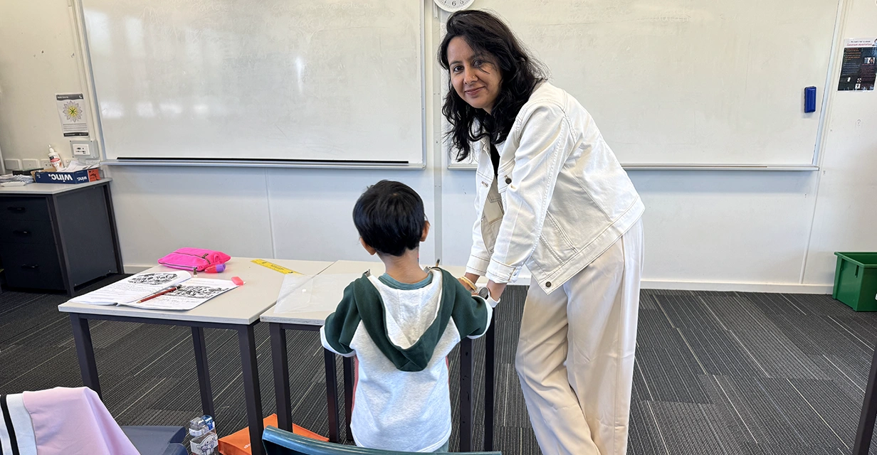 Tutors helping child practise NAPLAN reading comprehension at Coaching