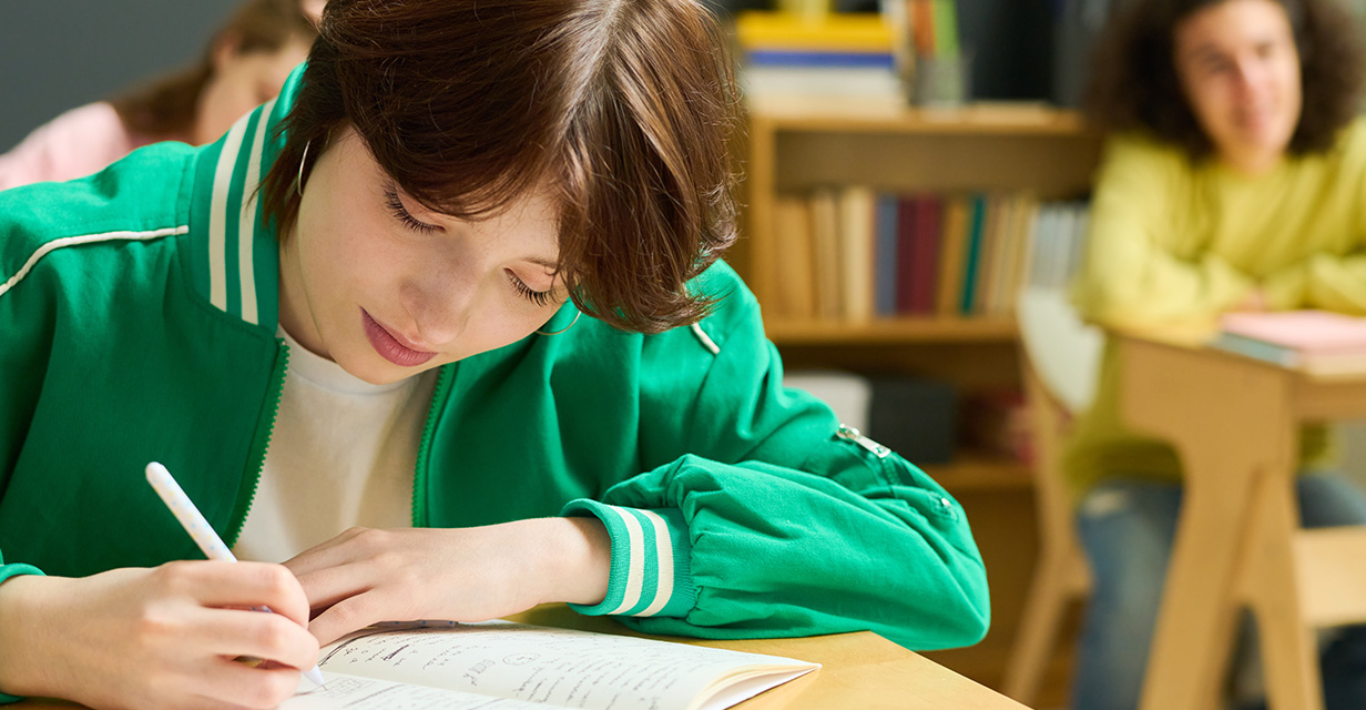 Year 3–9 student reading in library to build NAPLAN vocabulary