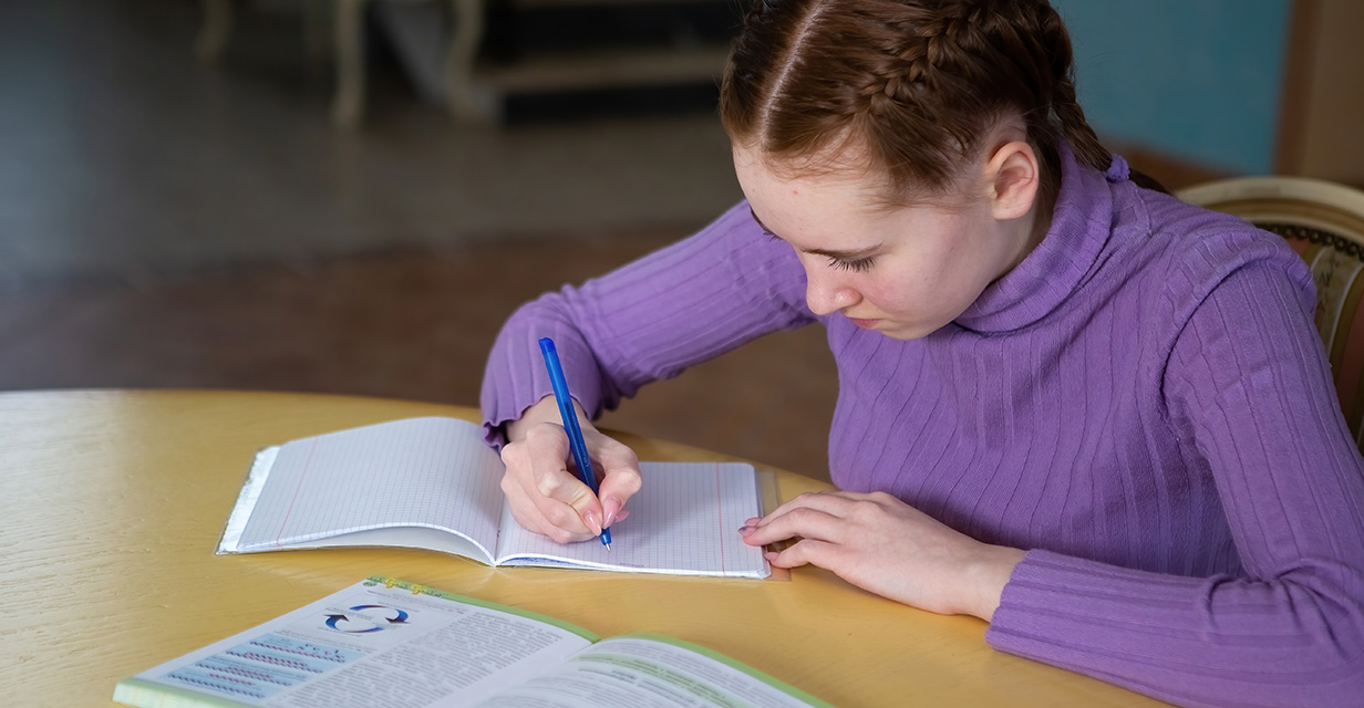 Year 3–9 student reading in library to build NAPLAN vocabulary